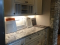 Koch Cabinetry - Bianco Granite Countertop - Berenson Hardware